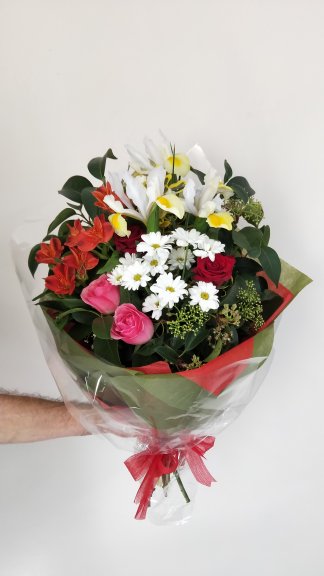 Created with roses, iris, alstroemeria, chrysco chrysanthemum and seasonal foliage, Radiance bouquet is ideal for many occasions.